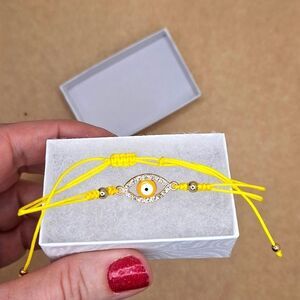 Yellow adjustable evil eye string protection bracelet